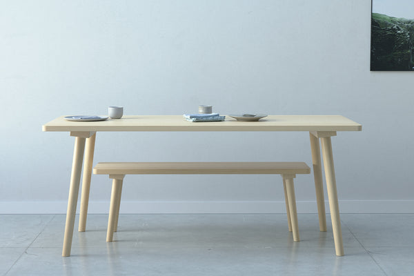A handmade Scandinavian minimalist designed wooden dining table with  turned round legs made from solid beech wood.
