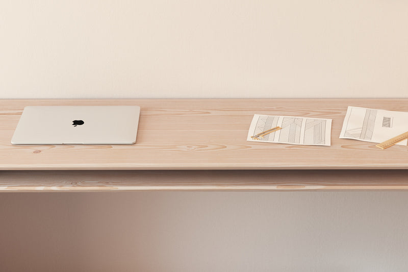 A handmade modern minimalist wooden desk in an architectural style made from Douglas fir wood.