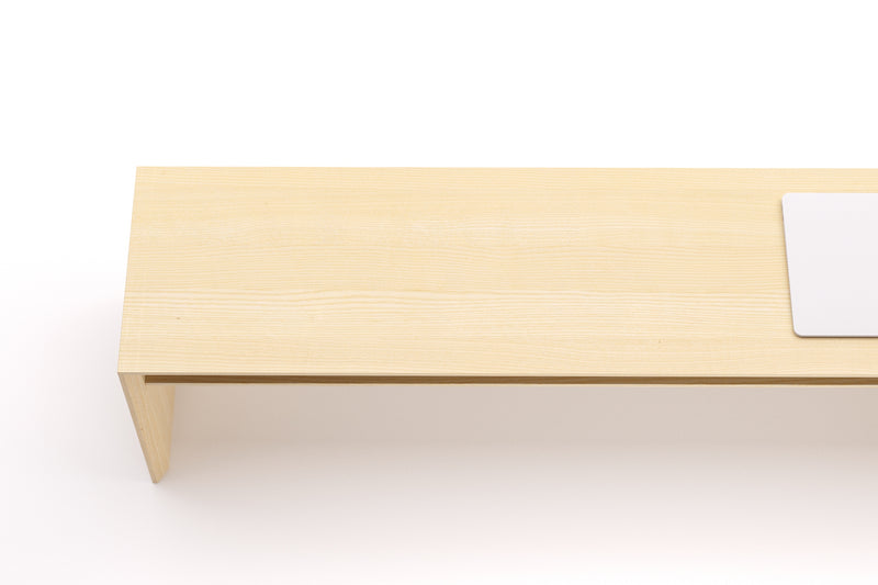 A Japanese minimalist style solid wooden bench made from ash.
