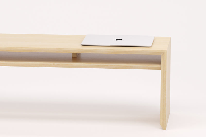 A Japanese minimalist style solid wooden bench made from ash.
